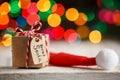 Christmas present or box for secret santa with Santa hat. Greeting card. Royalty Free Stock Photo