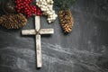 Christmas present and cross with pine cones