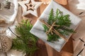 Christmas present decorated with branch in boho rustic style Royalty Free Stock Photo