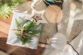 Christmas present decorated with branch in boho rustic style Royalty Free Stock Photo