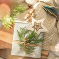 Christmas present decorated with branch in boho rustic style Royalty Free Stock Photo