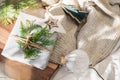 Christmas present decorated with branch in boho rustic style Royalty Free Stock Photo