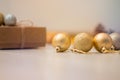 Christmas present, decoration balls and cones laying on the table. Xmas and new year background. Winter holidays concept Royalty Free Stock Photo