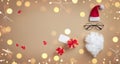 Christmas present or gift and funny face of Santa Claus on golden celebration background