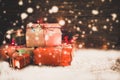 Christmas present gifts box and snow on old wooden background. Royalty Free Stock Photo