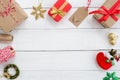 Christmas present gifts boxes and decoration elements on white wooden background. Royalty Free Stock Photo