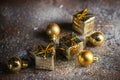 Christmas present mini golden box in the snow background. Close up. Christmas holiday celebration and new year concept. Winter hol Royalty Free Stock Photo