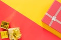 Christmas present red gifts box and decorating elements on red and yellow background. Top view and copy space. Christmas Royalty Free Stock Photo