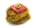 Christmas present on tinsel Royalty Free Stock Photo