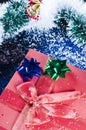 Christmas present and tinsel Royalty Free Stock Photo