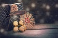 Christmas present in vintage style with straw stars and golden b Royalty Free Stock Photo