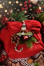 Christmas present wrapped in red knitted sweater with decors as creative idea Royalty Free Stock Photo