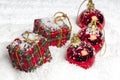 Christmas presents and baubles in the snow