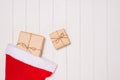 Christmas presents in decorative boxes on white wooden table background