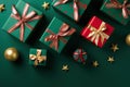 Christmas Presents Galore - Top View of Gift Boxes with Red, Green, Gold Bows, Baubles, and Star Ornaments on Isolated Green Royalty Free Stock Photo