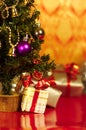 Christmas presents or gifts under tree vertical