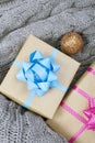 Christmas presents on a gray knitted background Royalty Free Stock Photo