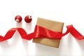 Christmas gift box and red silk ribbon on white background, top view Royalty Free Stock Photo