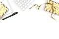 Christmas presents, notepad, pen and keyboard on white background. Business concept. Copy space.
