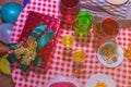 Christmas presents with red ribbon laid on a wooden table with glasses of wine and food in vintage style..Many Christmas presents Royalty Free Stock Photo