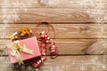 Christmas presents with snow crystal on wooden table background.