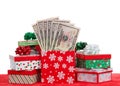 Many Christmas presents stuffed with money isolated on white