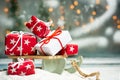 Christmas presents on wooden sledges with festive background