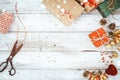 Christmas presents wrapping and snow over wooden table background Royalty Free Stock Photo