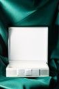 Christmas product display white gift box stand on green background. Gift box for show product, perfume, promotion sale