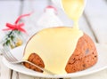 Christmas pudding with custard Royalty Free Stock Photo