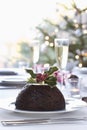 Christmas Pudding On Dining Table Royalty Free Stock Photo