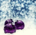 Christmas purple balls snow and space abstract background. Festive christmas abstract background with bokeh defocused lights. Royalty Free Stock Photo