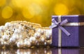 Christmas purple gift box, pearl necklace for woman Royalty Free Stock Photo