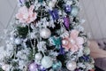 Christmas purple and silver decorations on the Christmas tree, snowflakes balls garlands, closeup texture background Royalty Free Stock Photo