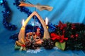 Christmas pyramid with candles, a wreath of fir branches and flo Royalty Free Stock Photo