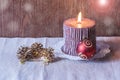 Christmas ball, candle and pine cones. Selective focus Royalty Free Stock Photo