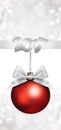 Christmas red ball with silver satin ribbon bow Royalty Free Stock Photo