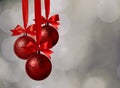 Christmas red balls and bow over magic bokeh Royalty Free Stock Photo