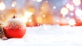 Christmas red balls. Celebration decoration, Christmas blurred background with snow. Close-up. Banner. Royalty Free Stock Photo