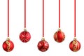 Christmas red balls with golden sparkles hanging on a ribbon for a Christmas tree close-up.