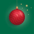 Christmas red bauble ball with golden waves hanging on a ribbon isolated on green, vector illustration. Christmas tree toy Royalty Free Stock Photo