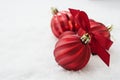 Christmas red baubles, balls isolated on snow. Winter greeting card with copy space Royalty Free Stock Photo