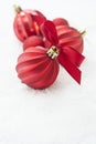 Christmas red baubles, balls isolated on snow. Winter greeting card with copy space Royalty Free Stock Photo