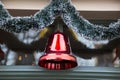 Christmas red big plastic traditional bell with fir needle Royalty Free Stock Photo