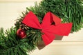 Christmas red bow on green New Year tree branch Royalty Free Stock Photo