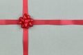 Christmas Red Bow and ribbon on brown paper background Royalty Free Stock Photo