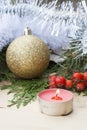 Christmas red candle on wooden table among Christmas and New Year ball and decor Royalty Free Stock Photo
