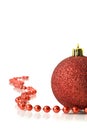 Christmas. Red Decoration ball and red tinsel Royalty Free Stock Photo