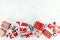 Christmas red gift boxes, jingle bells and silver pine cone on w Royalty Free Stock Photo