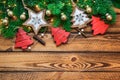 Christmas red gold vintage decoration with green fir branch over dark wooden background Royalty Free Stock Photo